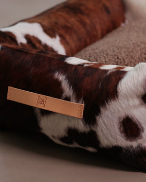 HENRI COWHIDE DOG BED | מיטה לכלב
